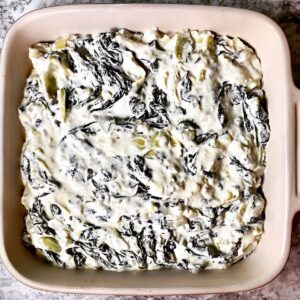 Casserole dish filled with spinach dip