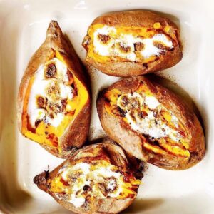 Baked sweet potatoes with roasted marshmallows in casserole dish