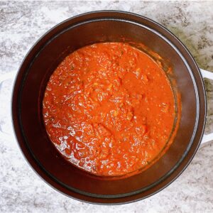 Staub dutch oven with homemade marinara inside