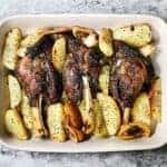 Lamb shanks and greek potatoes in casserole dish
