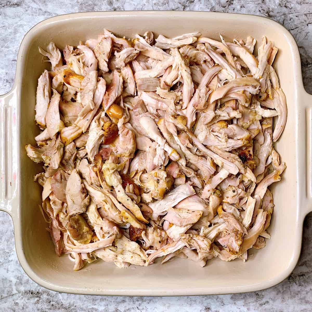 ceramic dish filled with shredded smoked barbecue chicken