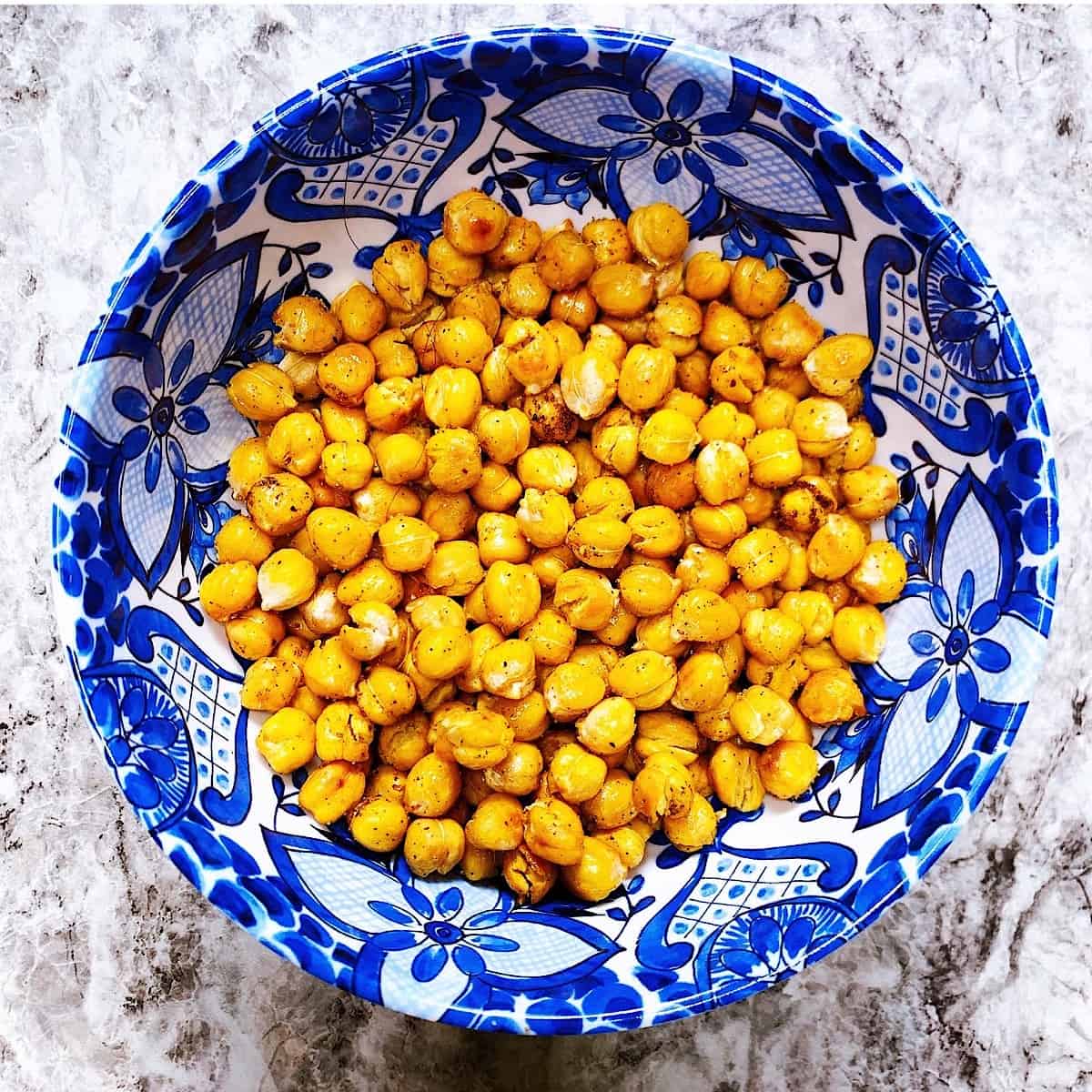 Decorative bowl filled with seasoned roasted chick peas