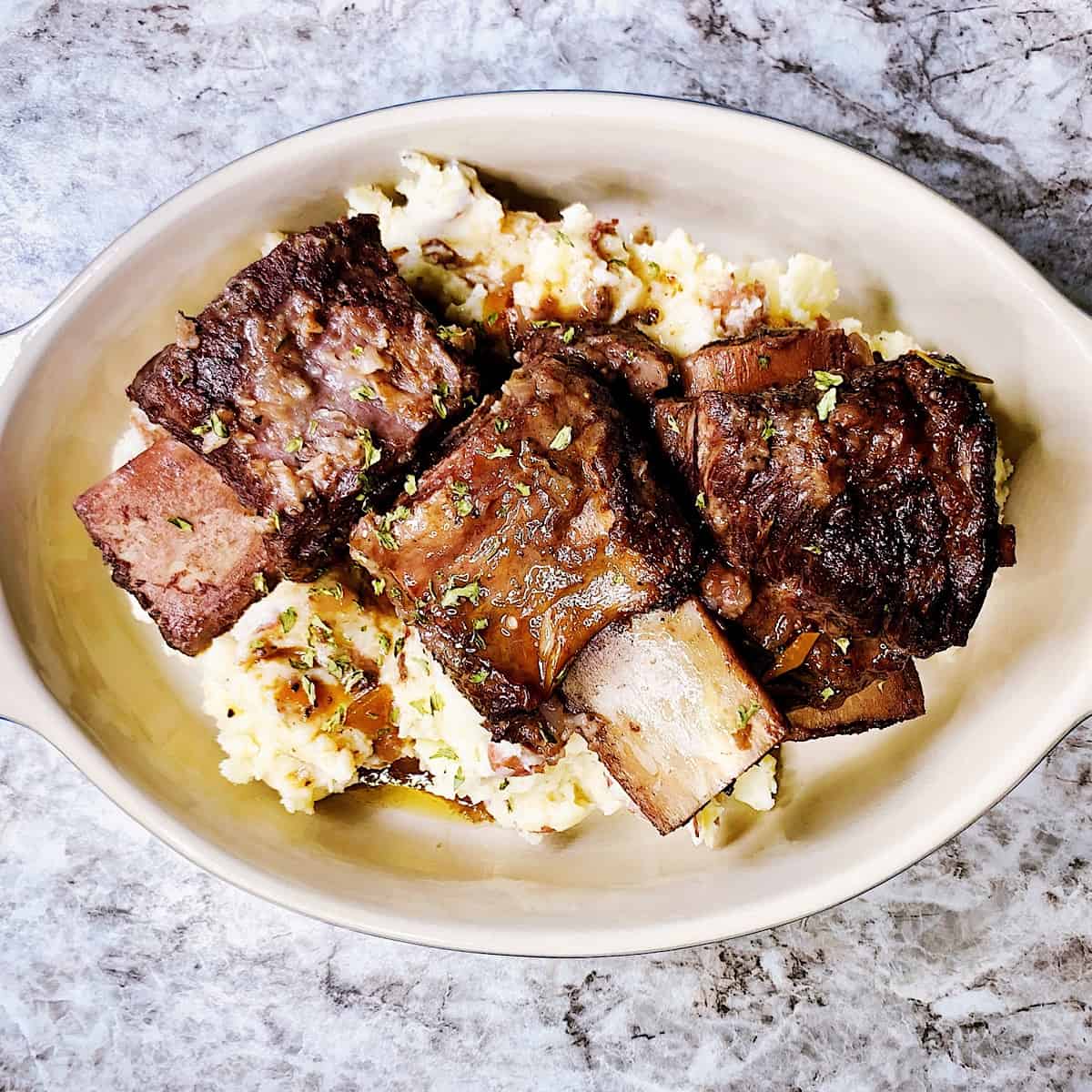 Braised short ribs in casserole dish