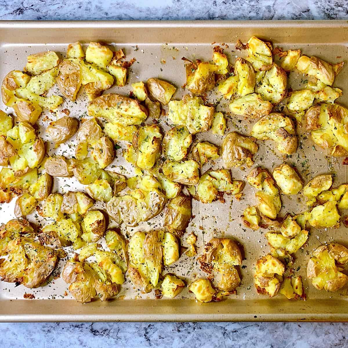 Smashed potatoes on copper sheet pan