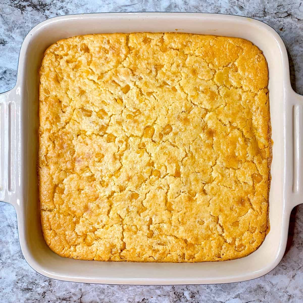 Corn Casserole in blue baking dish