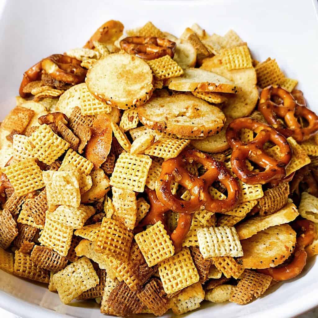 Homemade Chex Mix in white serving bowl