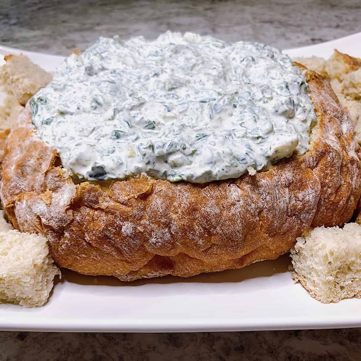 Spinach dip in bread bowl