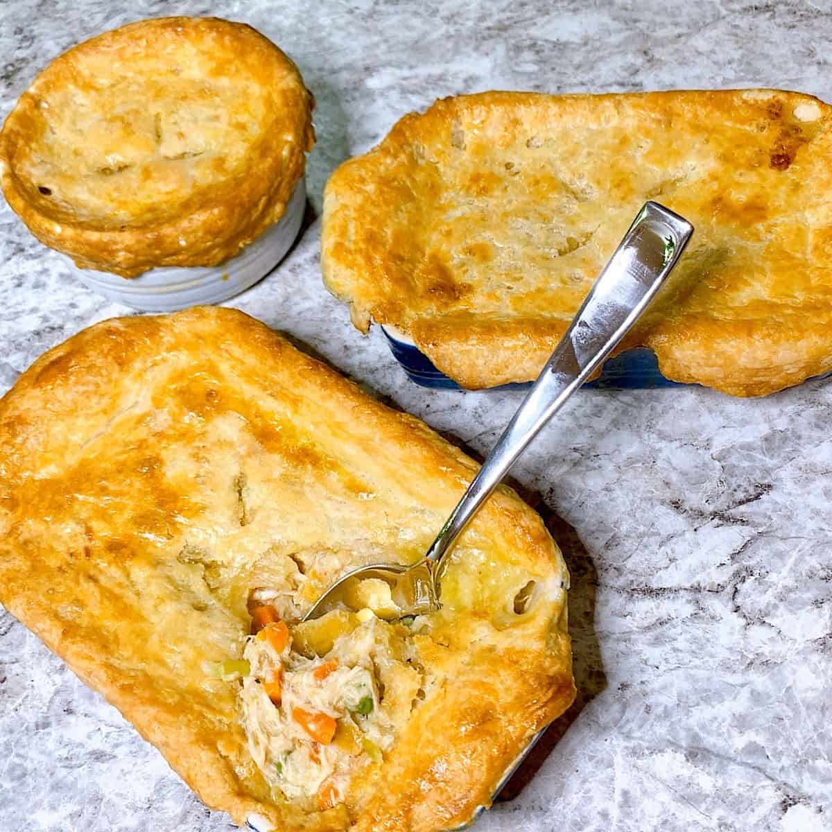 Single serve chicken pot pies in individual crocks with homemade crust