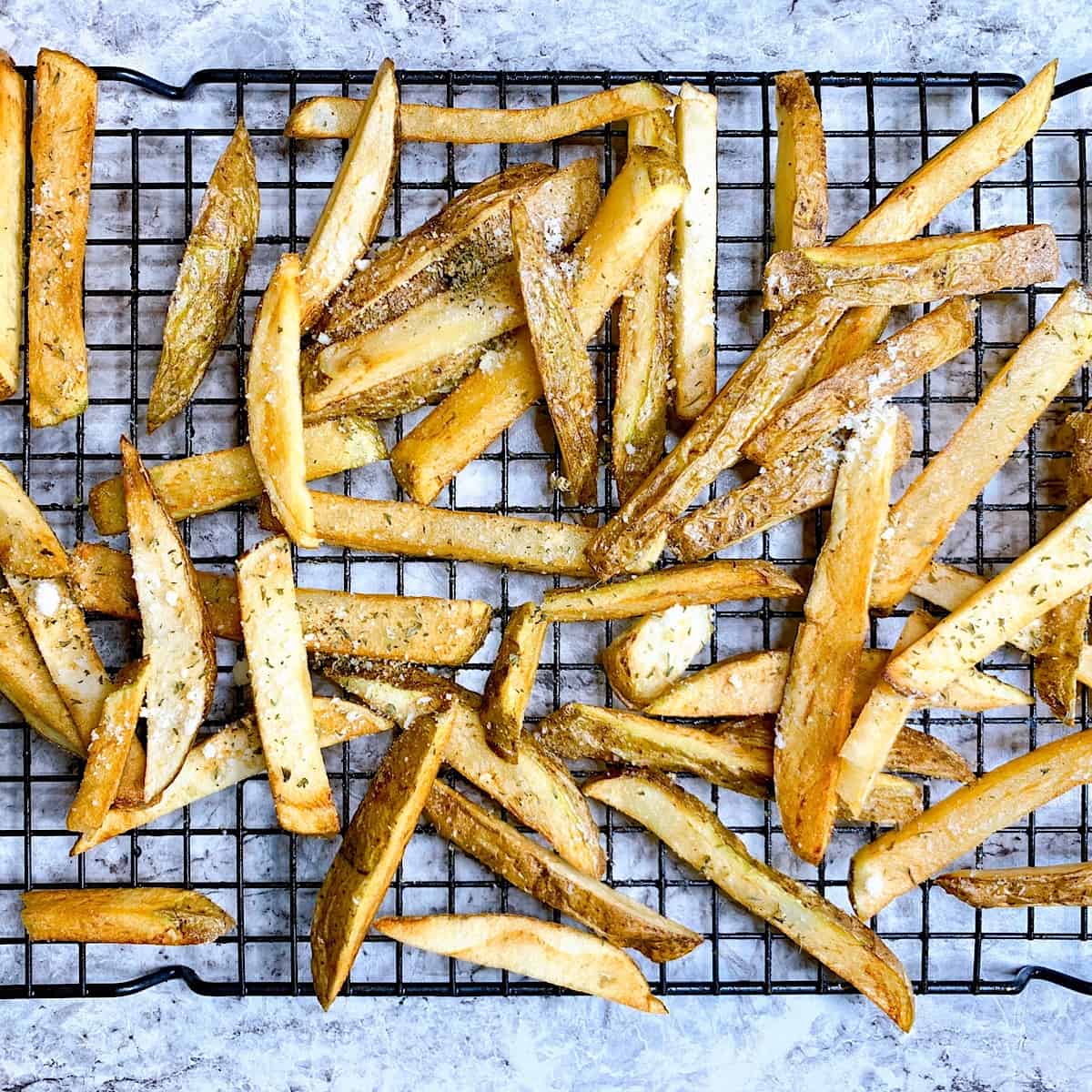 Garlic Parmesan Fries on wire grate