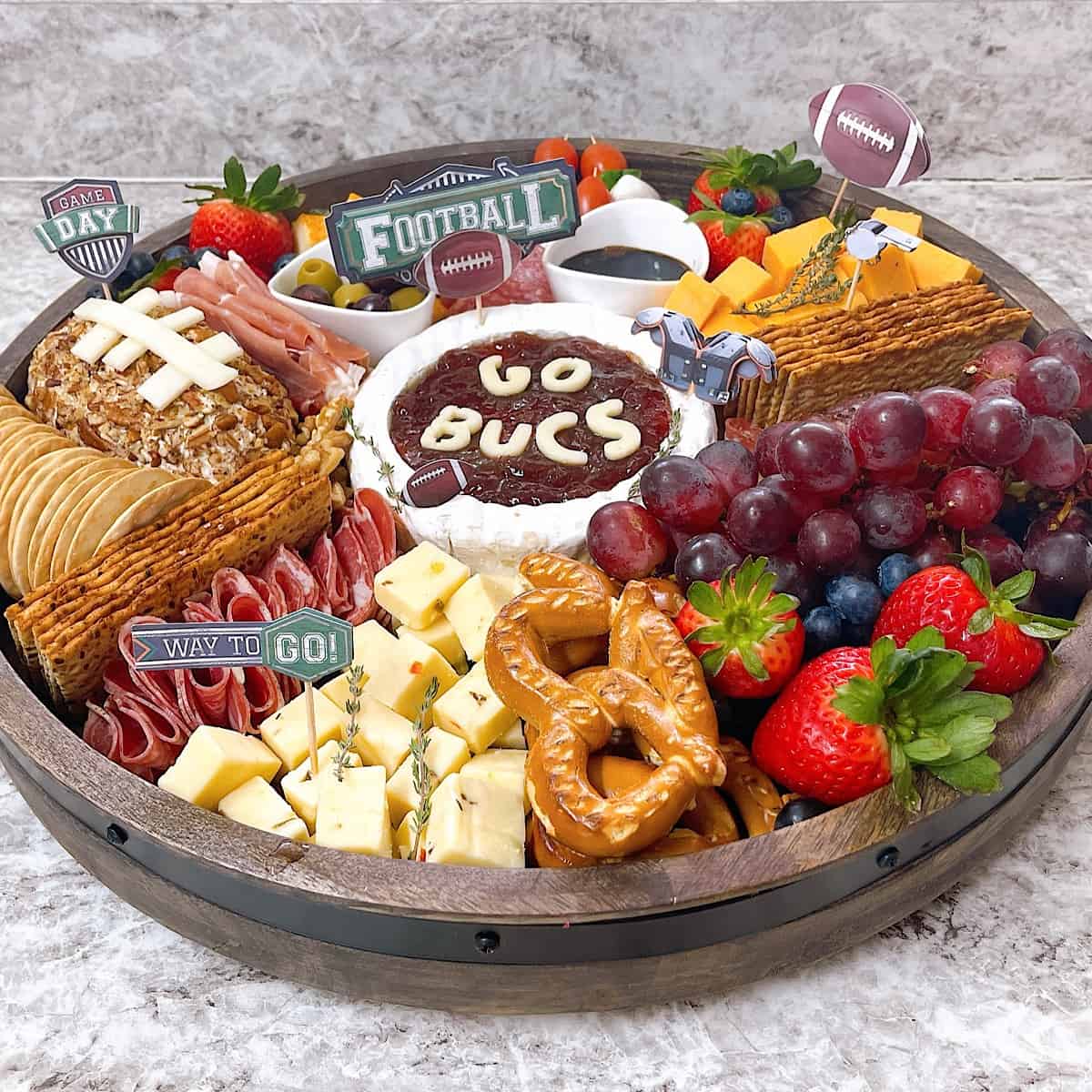 Football themed charcuterie board with meats and cheeses