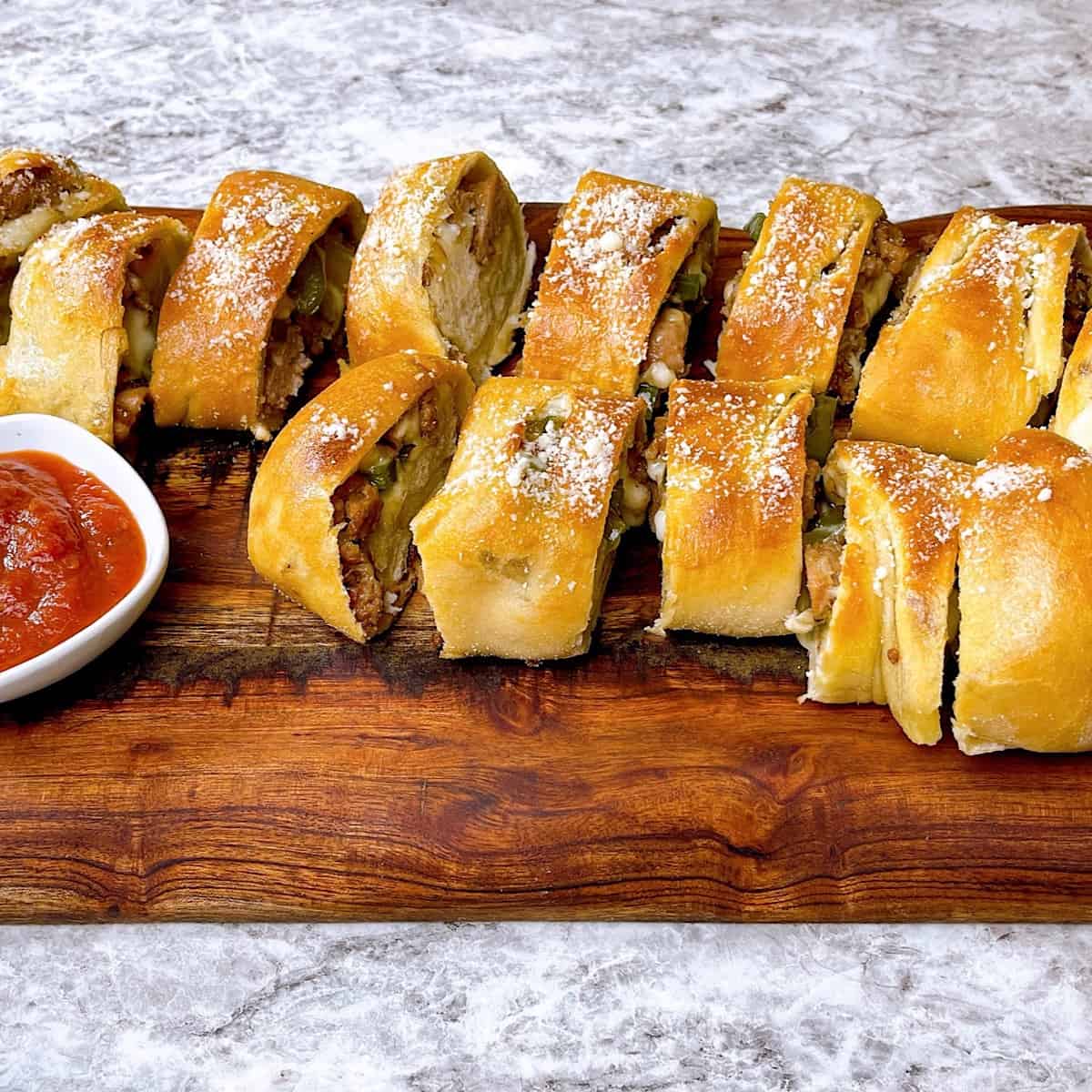 Stromboli cut into slices with marinara