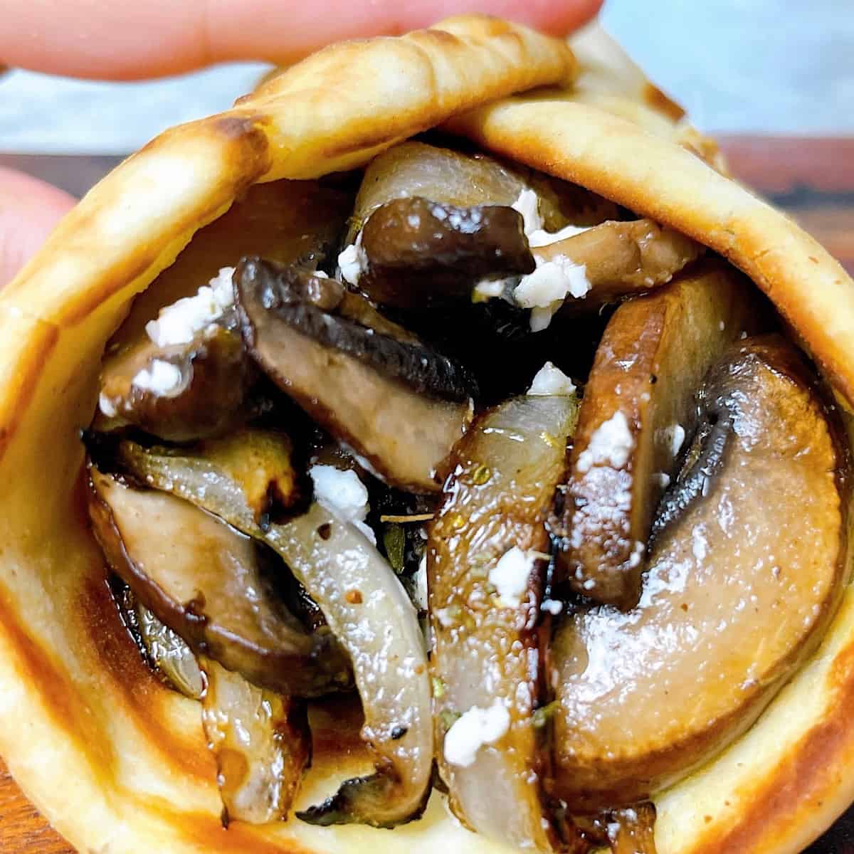Portobello Pita Wrap held in hand