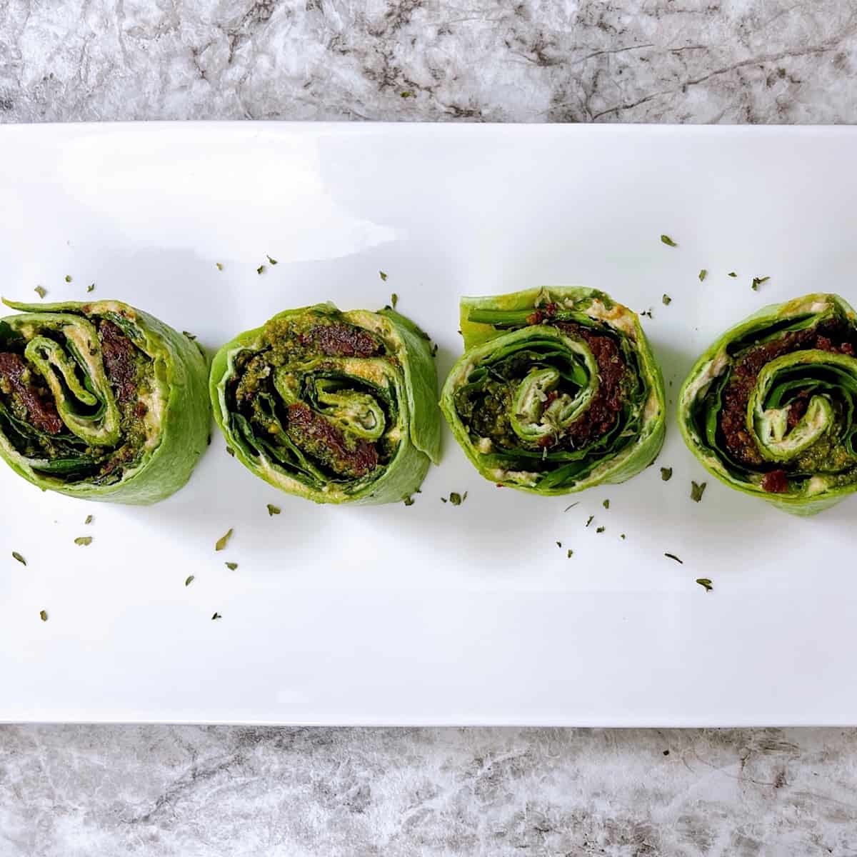 Pesto and Sundried Tomato Pinwheels on platter