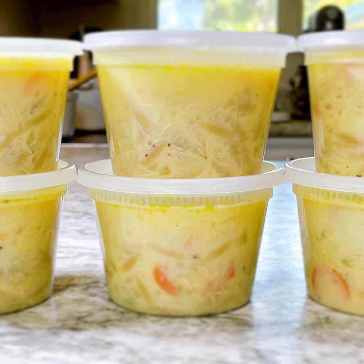 Avgolemono Soup Meal Prep in plastic containers ready for lunch or freezer