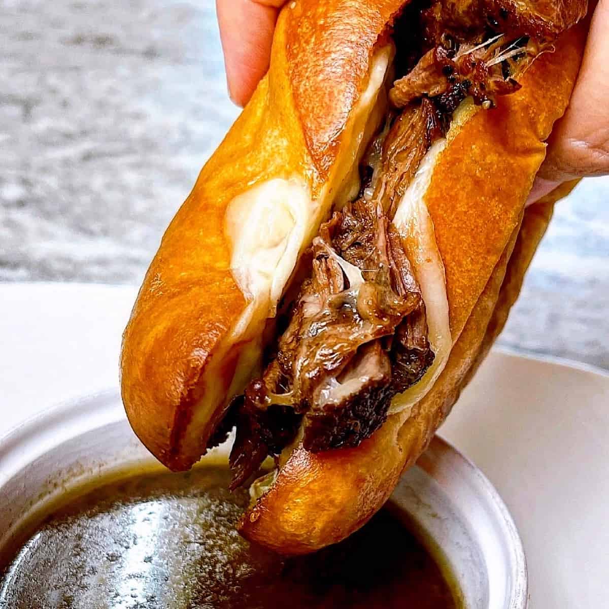 French Dip Sandwich dipped in aujus