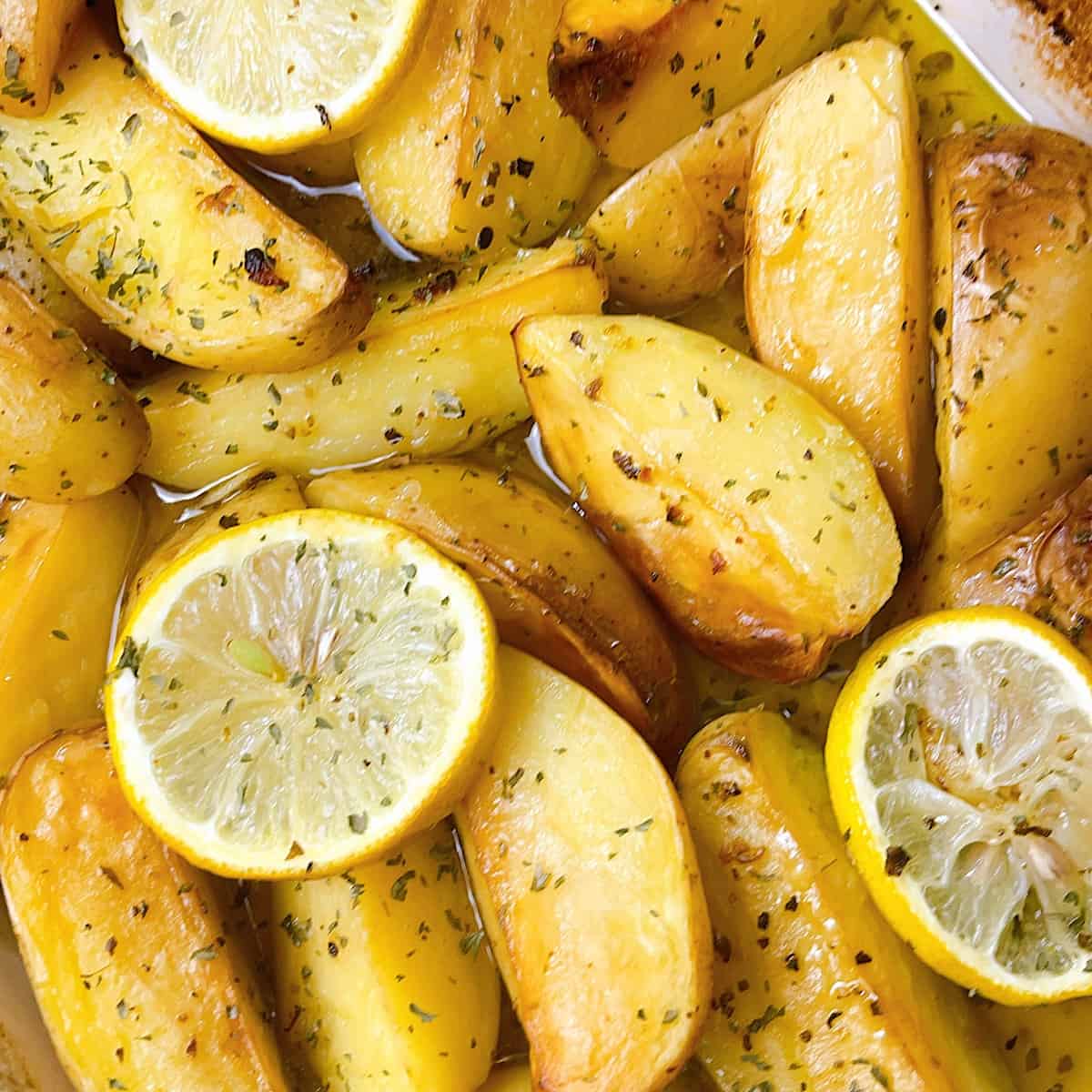 Greek Lemon Potatoes close up with lemon 