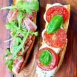 prosciutto caprese sandwich open faced with all of the fixings.