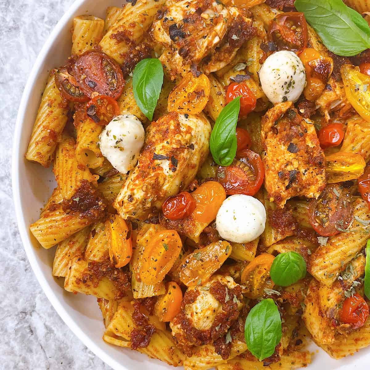 Chicken Pesto Rosso in white bowl side shot