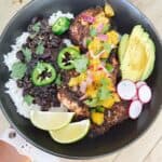 Southwest chicken bowl with pineapple habanero salsa - outside pic while holding in hand. Feature image.