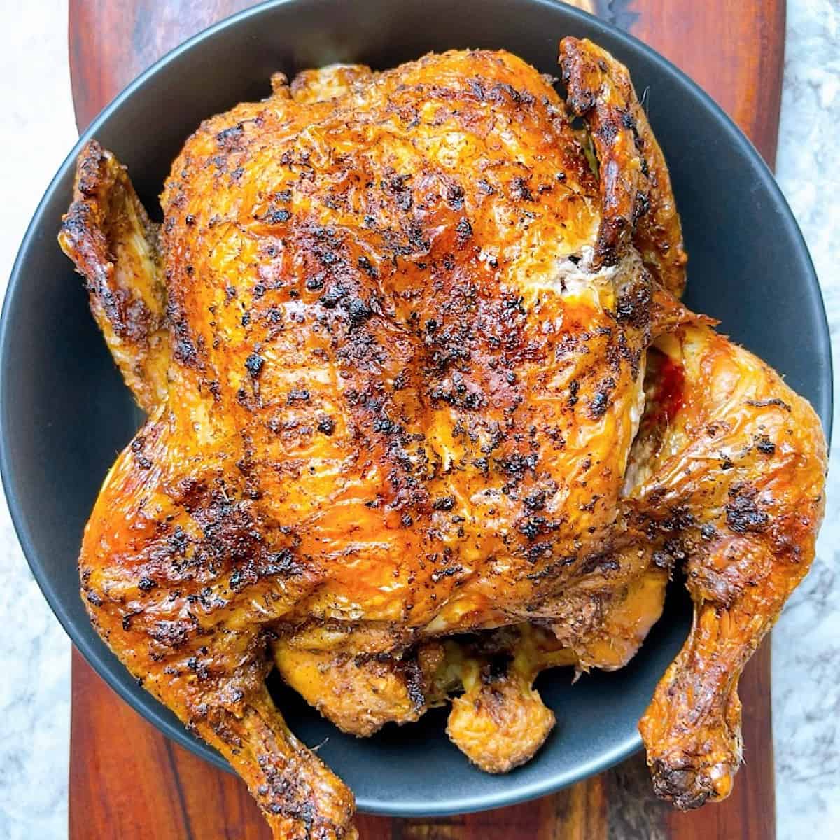 Whole Air Fryer Chicken on large platter cooked