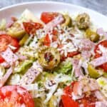 1905 salad in white bowl tossed and ready to eat.