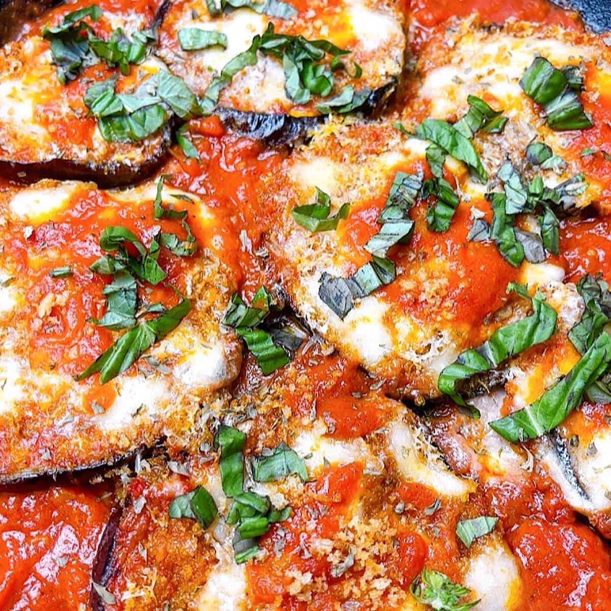Roasted Eggplant Parmesan close up with fresh basil
