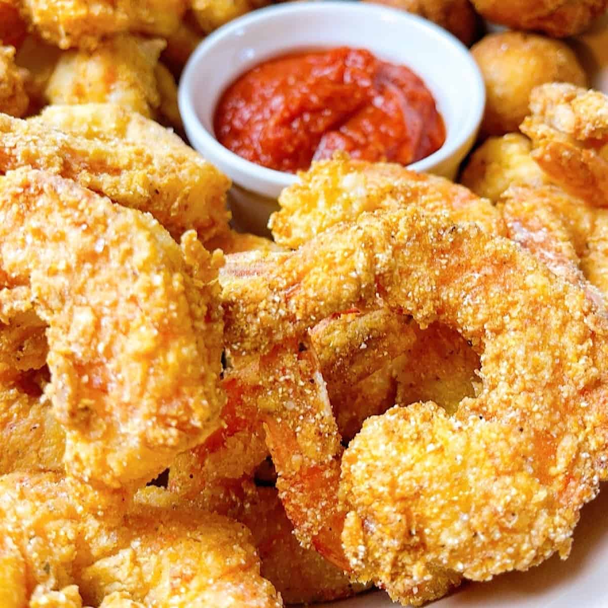 Fried Creole Shrimp close up with cocktail sauce