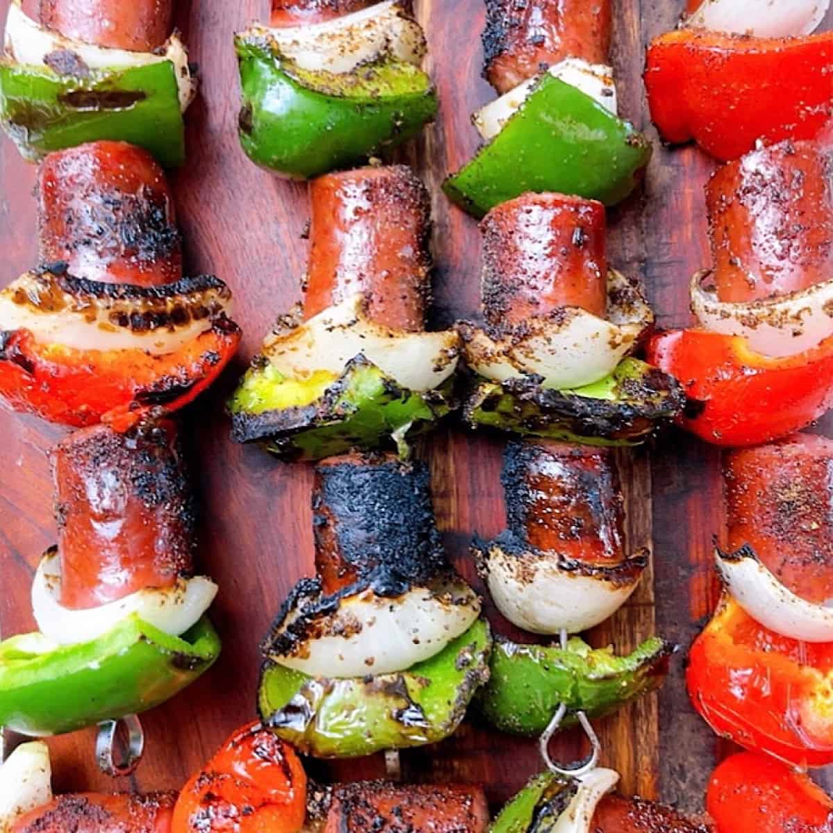 Jalapeño Smoked Kielbasa Kabobs on a wooden cutting board