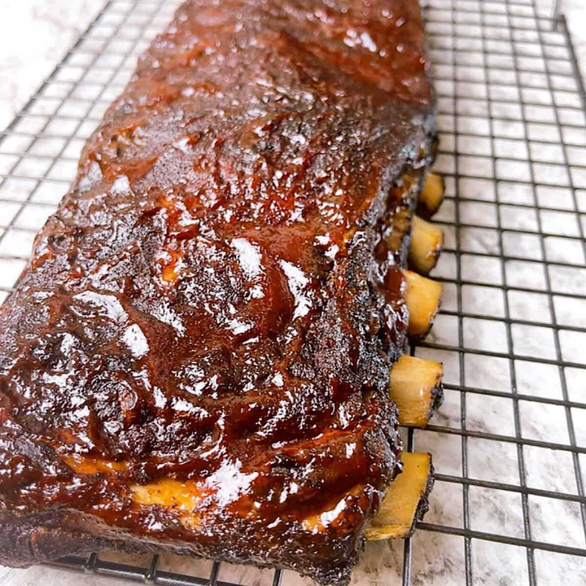 Low and Slow Oven Baked Ribs Close Up with barbecue sauce