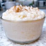 greek rice pudding feature image close up in bowl with cinnamon