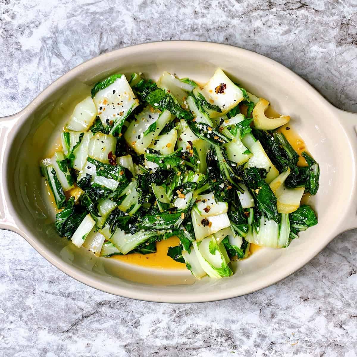 Sauteed Bok Choy in small blue casserole dish