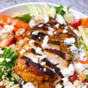 Close up of Nashville hot chicken salad with homemade buttermilk ranch dressing in a white bowl