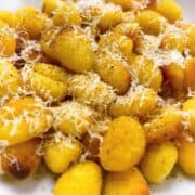 Close up of toasted air fryer gnocchi with brown butter and parmesan feature