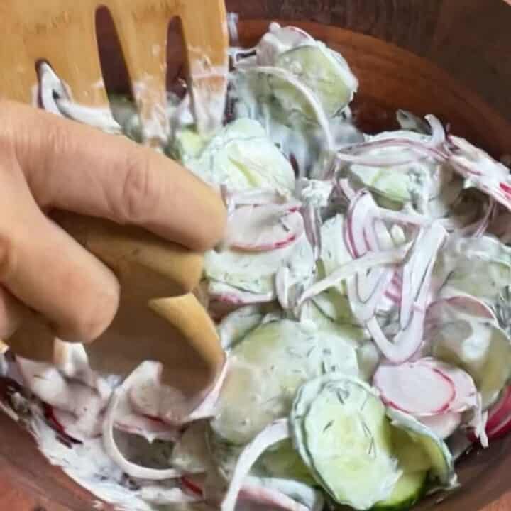 Creamy Cucumber Radish Salad Process Shot being tossed.