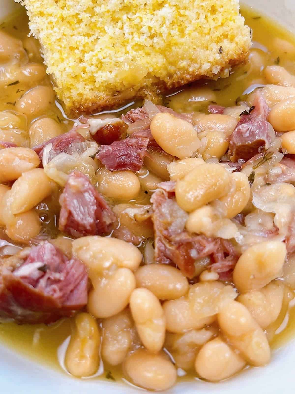 Instant Pot Ham and Beans Hero shot. Close up with cornbread.