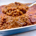 The best baked beans recipe with ground beef feature image close up in serving spoon