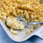 Creamy gouda Mac and cheese feature image scooped with spoon resting
