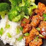 Easy orange chicken recipe feature image close up in bowl with broccoli and jasmine rice