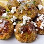 Greek lamb meatballs keftedes with toppings.