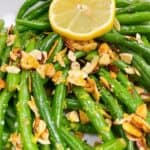 Green beans with almonds feature image close up with lemon