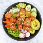 Salmon Rice Bowl recipe close up with all the vegetables and garnish.