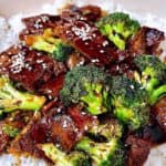 Better than take out beef and broccoli stir fry feature image close up with sesame seeds over rice