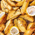 Easy Crispy Greek Lemon Potatoes Recipe feature image close up roasted potatoes with garnish