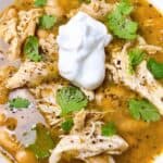 easy instant pot white chicken chili with white beans and salsa verde feature image close up with toppings.