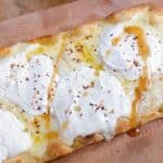 Easy flatbread with ricotta and hot honey feature image close up of finished dish.