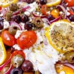 Baked Mediterranean flaky fish and toppings.