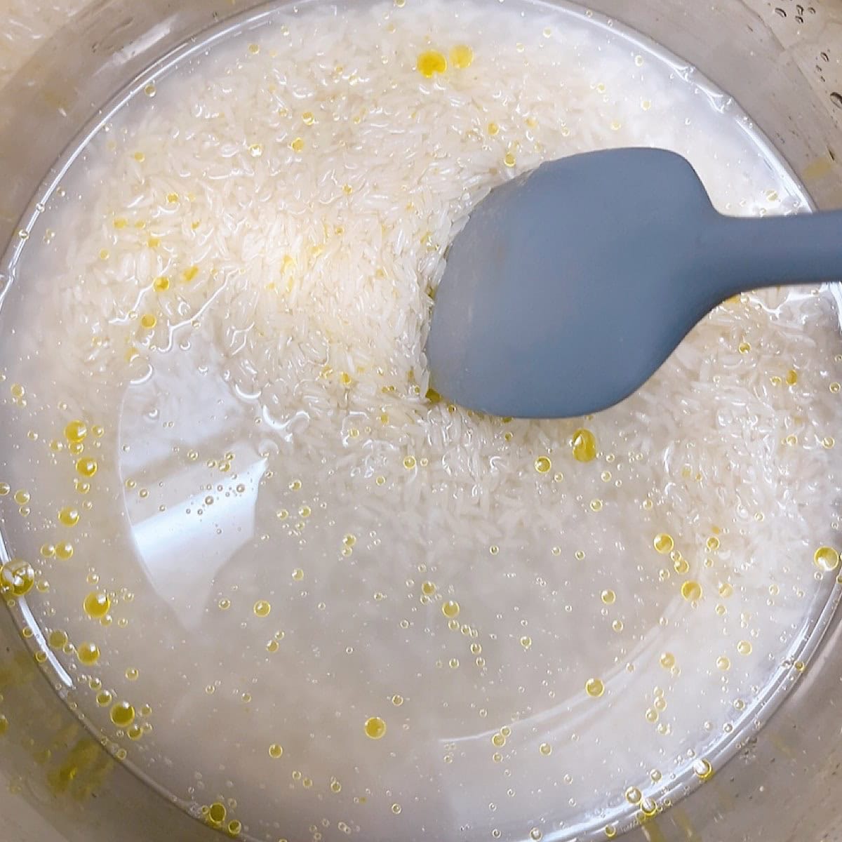 Jasmine rice instant pot recipe process shot 2 combining ingredients prior to pressure cooking.
