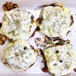 mushroom swiss burger recipe feature image close up with four patties and all the toppings