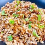 Old fashioned stick of butter rice recipe feature image close up in spoon