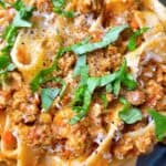 pappardelle bolognese recipe authentic homemade Italian sauce feature image close up with parmesan and basil